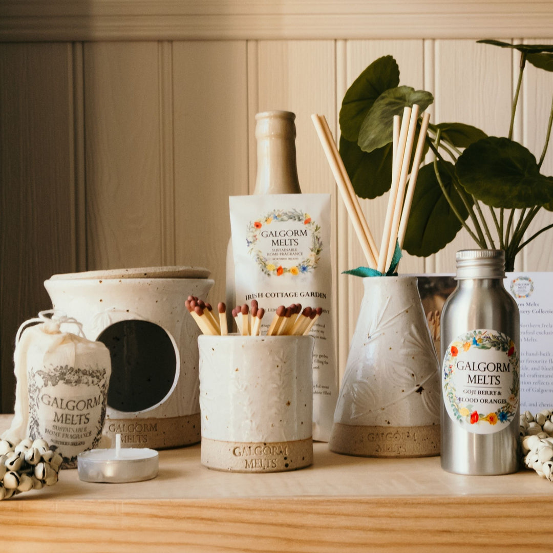 Give the gift of a cosy new beginning. Our personalised Wedding Bundle includes handcrafted pottery, bespoke scents, and luxury gift presentation. Shop Galgorm Melts.